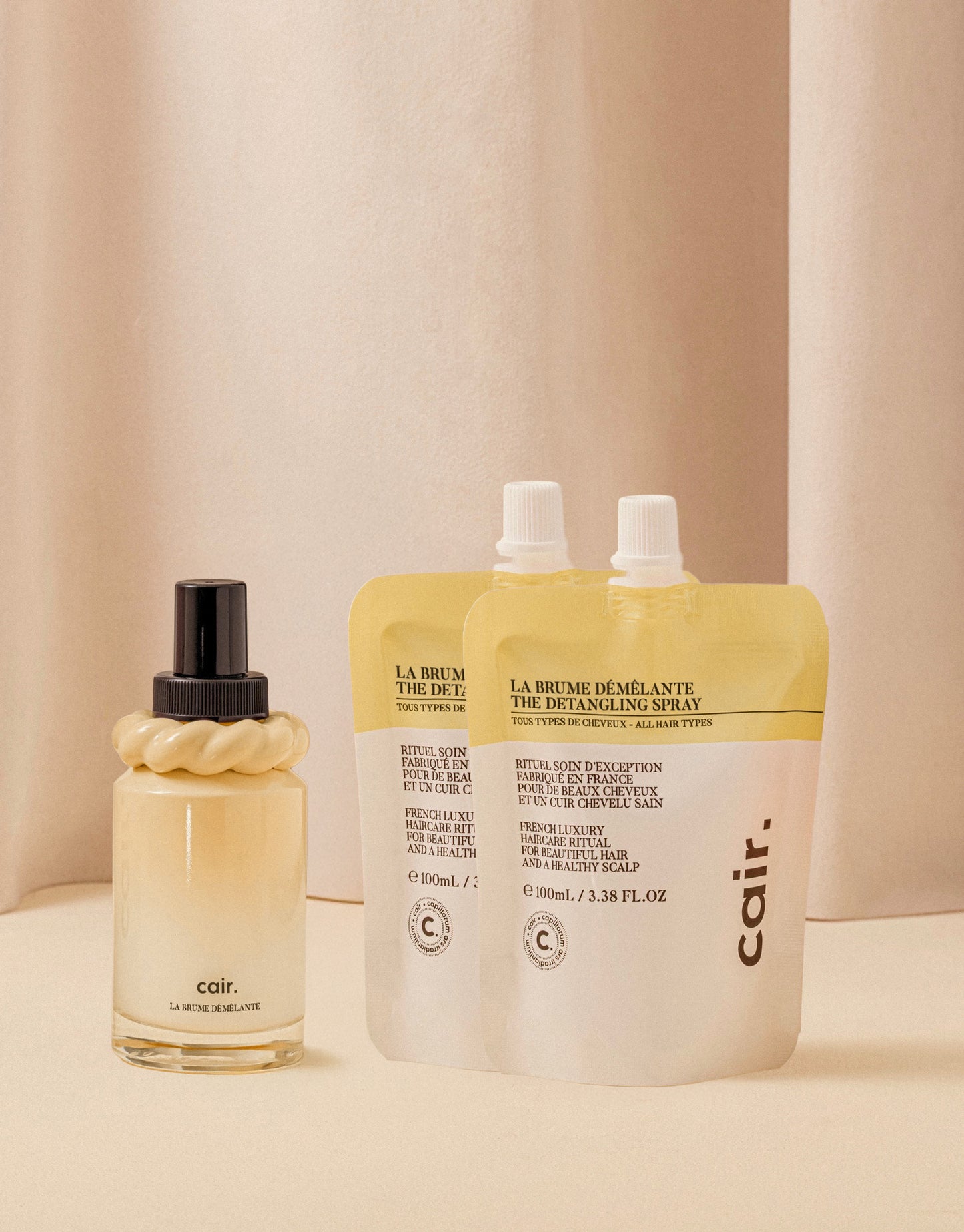 Our detangling mist and its two refills